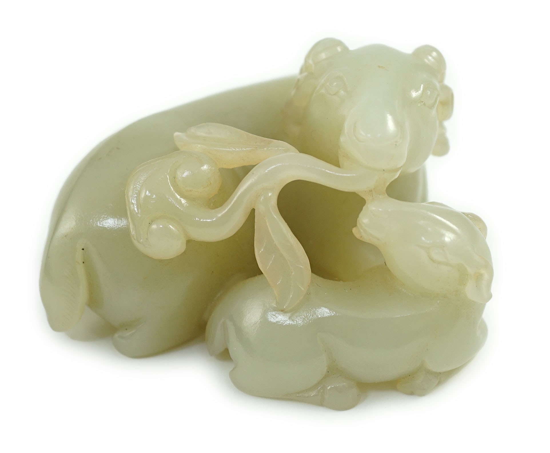 A Chinese pale celadon jade ram group, 7cm long